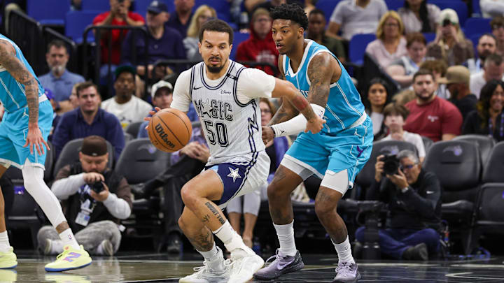 Orlando Magic guard Cole Anthony (50) controls the ball in front of Charlotte Hornets guard Elfrid Payton (22) during the first quarter at Kia Center.