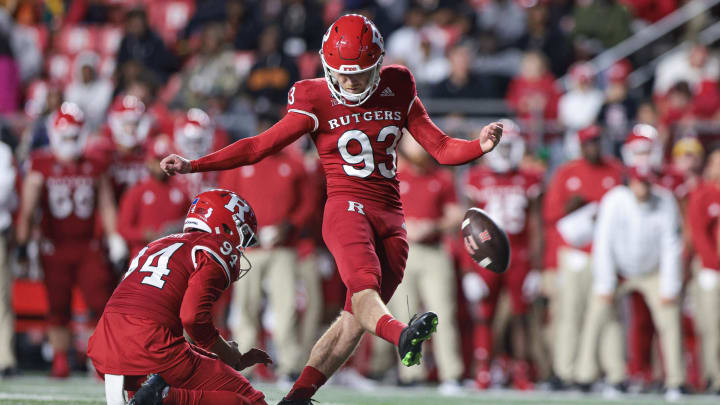 Sep 24, 2022; Piscataway, New Jersey, USA; Rutgers Scarlet Knights place kicker Jude McAtamney (93) kicks a field goal as punter Adam Korsak (94) holds during the first half against the Iowa Hawkeyes at SHI Stadium.  