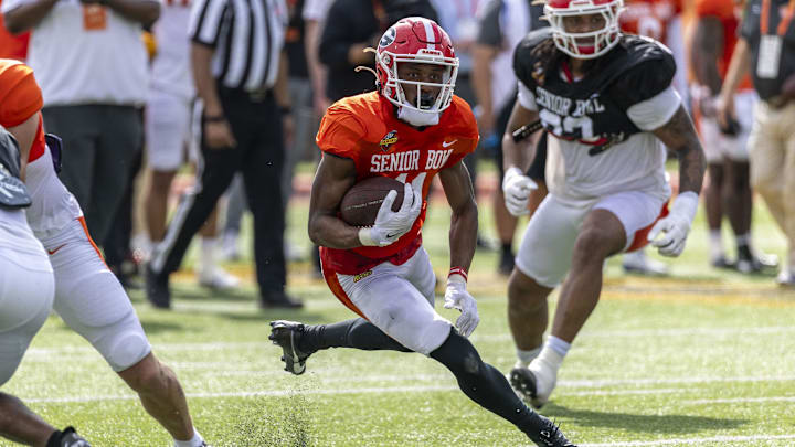 Jan 29, 2025; Mobile, AL, USA; American team wide receiver Arian Smith of Georgia (11) runs through a hole during Senior Bowl practice for the American team at Hancock Whitney Stadium. Mandatory Credit: Vasha Hunt-Imagn Images