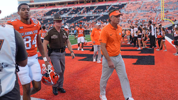 Oklahoma State coach Mike Gundy walks of the field after a college football game between the Oklahoma State Cowboys (OSU) and the West Virginia Mountaineers at Boone Pickens Stadium in Stillwater, Okla., Saturday, Oct. 5, 2024.