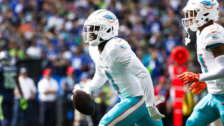 Miami Dolphins cornerback Kader Kohou (4) celebrates following an interception against the Seattle Seahawks during the first quarter at Lumen Field. Miami Dolphins cornerback Kader Kohou (4) celebrates following an interception against the Seattle Seahawks during the first quarter at Lumen Field.