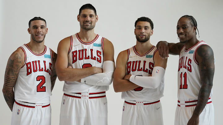 Sep 27, 2021; Chicago, Illinois, USA; Chicago Bulls guard Lonzo Ball (2) center Nikola Vucevic (9) guard Zach LaVine (8) and  forward DeMar DeRozan (11) pose for photos during Chicago Bulls Media Day at the United Center. Mandatory Credit: David Banks-Imagn Images