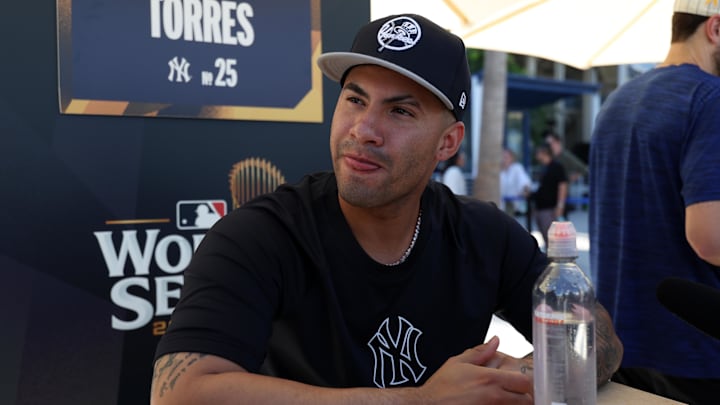 Oct 24, 2024; Los Angeles, CA, USA;  New York Yankees second base Gleyber Torres (25) speaks to media during workout day at Dodgers Stadium. Mandatory Credit: Kiyoshi Mio-Imagn Images