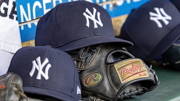 Apr 7, 2025; Detroit, Michigan, USA; New York Yankees baseball hats and gloves in the dugout out in the eighth inning against the Detroit Tigers at Comerica Park. Mandatory Credit: David Reginek-Imagn Images