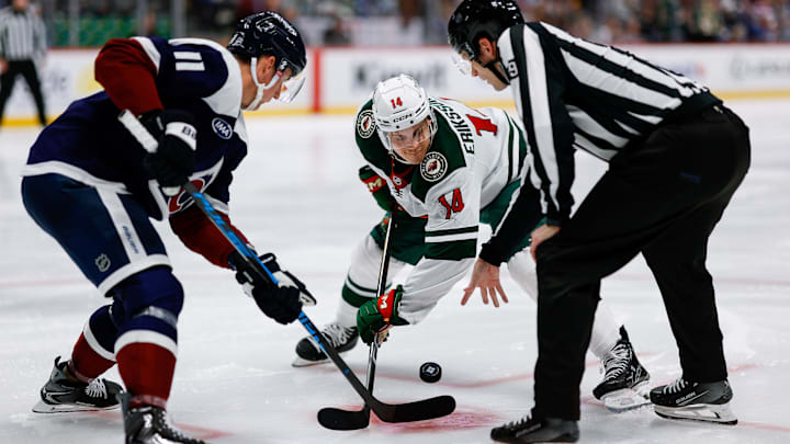 Mar 8, 2026; Denver, Colorado, USA; Colorado Avalanche center Brock Nelson (11) faces off against Minnesota Wild center Joel Eriksson Ek (14) on a puck drop from linesman Joe Mahon (89) in the third period at Ball Arena. Mandatory Credit: Isaiah J. Downing-Imagn Images