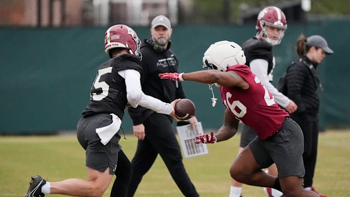 Mar 5, 2025; Tuscaloosa, AL, USA; Quarterback Ty Simpson (15) hands off to running back Jam Miller (26) during Spring Practice for the Crimson Tide.