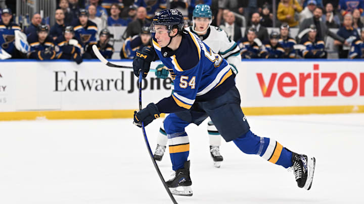 Mar 26, 2026; St. Louis, Missouri, USA; St. Louis Blues right wing Dalibor Dvorsky (54) takes a shot against the San Jose Sharks in overtime at Enterprise Center. Mandatory Credit: Joe Puetz-Imagn Images