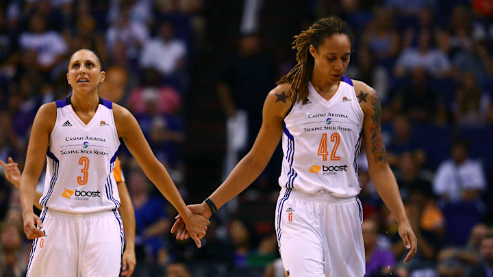 Sep 9, 2014; Phoenix, AZ, USA; Phoenix Mercury guard Diana Taurasi (3) holds hands with center Brittney Griner (42) in the second quarter against the Chicago Sky during game two of the WNBA Finals at US Airways Center. Mandatory Credit: Mark J. Rebilas-Imagn Images
