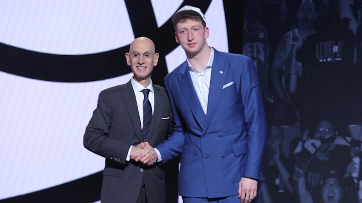 Jun 25, 2025; Brooklyn, NY, USA; Danny Wolf stands with NBA commissioner Adam Silver after being selected as the 27th pick by the Brooklyn Nets in the first round of the 2025 NBA Draft at Barclays Center. Mandatory Credit: Brad Penner-Imagn Images Jun 25, 2025; Brooklyn, NY, USA; Danny Wolf stands with NBA commissioner Adam Silver after being selected as the 27th pick by the Brooklyn Nets in the first round of the 2025 NBA Draft at Barclays Center. Mandatory Credit: Brad Penner-Imagn Images