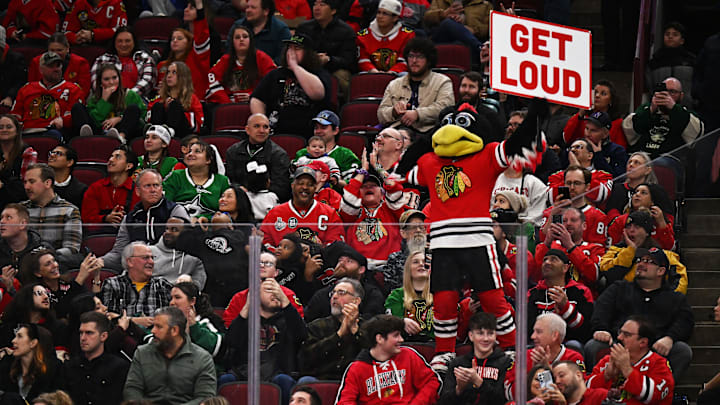 Mar 2, 2023; Chicago, Illinois, USA;  Chicago Blackhawks mascot Tommy Hawk rallies the crowd during a game against the Dallas Stars at United Center. Mandatory Credit: Jamie Sabau-Imagn Images