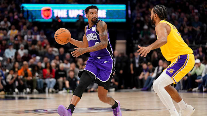 Dec 19, 2024; Sacramento, California, USA; Sacramento Kings guard Malik Monk (0) dribbles the ball next to Los Angeles Lakers guard Gabe Vincent (7) in the third quarter at the Golden 1 Center. Mandatory Credit: Cary Edmondson-Imagn Images