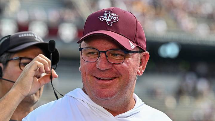Oct 5, 2024; College Station, Texas, USA; Texas A&M Aggies head coach Mike Elko gets ready for a pre-game interview with the SEC Nation prior to the game against the Missouri Tigers at Kyle Field. Mandatory Credit: Maria Lysaker-Imagn Images. 