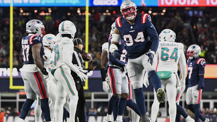 New England Patriots defensive tackle Cory Durden (94) reacts to a defensive stop against the Miami Dolphins during the first half at Gillette Stadium.