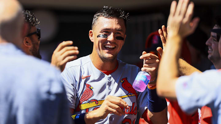 Aug 31, 2025; Cincinnati, Ohio, USA; St. Louis Cardinals outfielder Lars Nootbaar (21) high fives teammates after scoring on a sacrifice fly out hit by designated hitter Ivan Herrera (not pictured) in the third inning against the Cincinnati Reds at Great American Ball Park. Mandatory Credit: Katie Stratman-Imagn Images