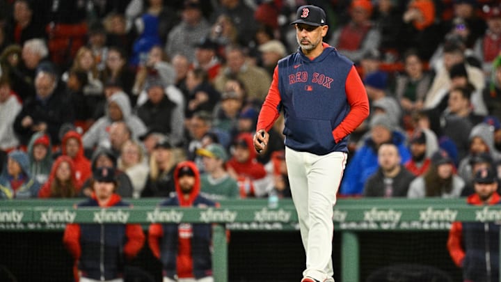 May 21, 2025; Boston, Massachusetts, USA; Boston Red Sox manager Alex Cora (13) walks to the mound during the sixth inning against the New York Mets at Fenway Park.