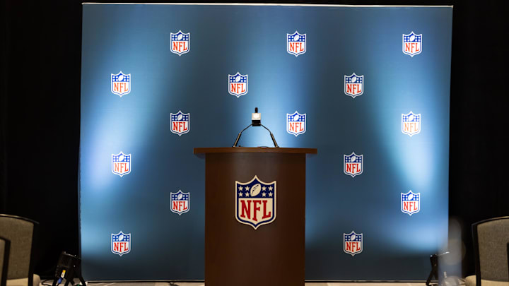Mar 30, 2026; Phoenix, AZ, USA; Detailed view of the NFL shield logo on a lectern in a press conference room during the 2026 NFL Annual League Meeting 