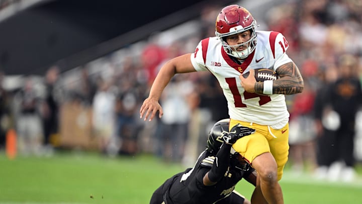USC Trojans quarterback Jayden Maiava (14) is tackled by Purdue Boilermakers defensive back Hudauri Hines (4) during the second quarter at Ross-Ade Stadium. Credit: Marc Lebryk-Imagn Images USC Trojans quarterback Jayden Maiava (14) is tackled by Purdue Boilermakers defensive back Hudauri Hines (4) during the second quarter at Ross-Ade Stadium. Credit: Marc Lebryk-Imagn Images