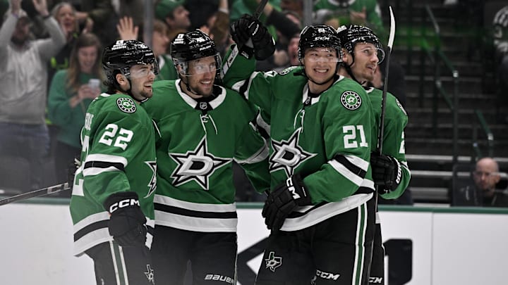Mar 4, 2025; Dallas, Texas, USA;Dallas Stars center Mavrik Bourque (22) and defenseman Ilya Lyubushkin (46) and left wing Jason Robertson (21) and center Roope Hintz (24) celebrate a goal during the game between the Dallas Stars and the New Jersey Devils at the American Airlines Center.