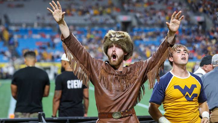 Sep 19, 2026; Charlotte, North Carolina, USA; The West Virginia Mountaineers mascot celebrates during the first quarter against the Virginia Cavaliers at Bank of America Stadium. Mandatory Credit: Ben Queen-Imagn Images Sep 19, 2026; Charlotte, North Carolina, USA; The West Virginia Mountaineers mascot celebrates during the first quarter against the Virginia Cavaliers at Bank of America Stadium. Mandatory Credit: Ben Queen-Imagn Images
