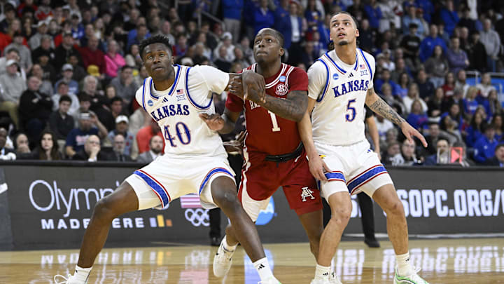 Mar 20, 2025; Providence, RI, USA;  Arkansas Razorbacks guard Johnell Davis (1) and Kansas Jayhawks forward Flory Bidunga (40) and guard Zeke Mayo (5) look on during the second half at Amica Mutual Pavilion. Mandatory Credit: Eric Canha-Imagn Images