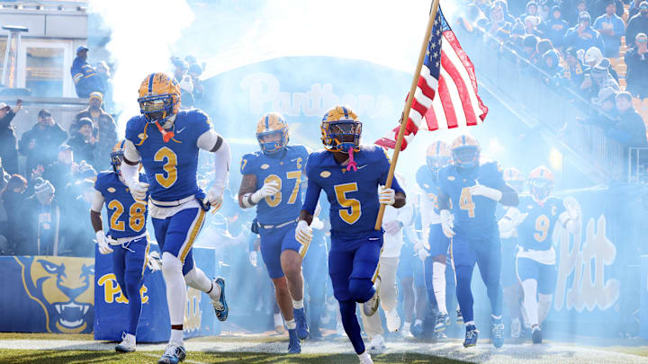 Nov 29, 2025; Pittsburgh, Pennsylvania, USA; Pittsburgh Panthers linebacker Rasheem Biles (3) and wide receiver Raphael Williams Jr. (5) lead the team onto the field to play the Miami Hurricanes at Acrisure Stadium. Mandatory Credit: Charles LeClaire-Imagn Images Nov 29, 2025; Pittsburgh, Pennsylvania, USA; Pittsburgh Panthers linebacker Rasheem Biles (3) and wide receiver Raphael Williams Jr. (5) lead the team onto the field to play the Miami Hurricanes at Acrisure Stadium. Mandatory Credit: Charles LeClaire-Imagn Images