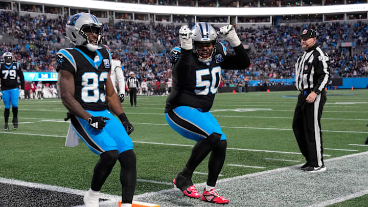 Dec 1, 2024; Charlotte, North Carolina, USA; Carolina Panthers wide receiver David Moore (83) and guard Robert Hunt (50) celebrate after quarterback Bryce Young (9) (not pictured) scores a touchdown in the second quarter at Bank of America Stadium. Mandatory Credit: Bob Donnan-Imagn Images
