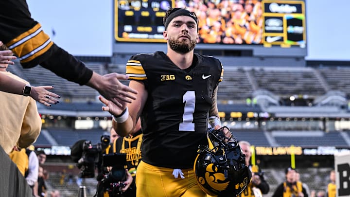 Oct 26, 2024; Iowa City, Iowa, USA; Iowa Hawkeyes quarterback Brendan Sullivan (1) runs off the field and greets fans after a game against the Northwestern Wildcats at Kinnick Stadium.