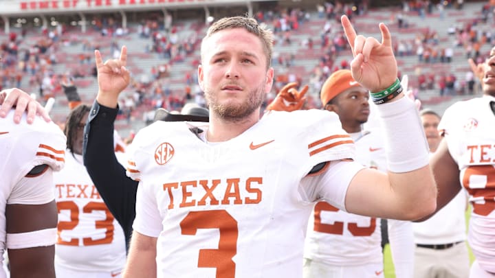 Nov 16, 2024; Fayetteville, Arkansas, USA; Texas Longhorns quarterback Quinn Ewers (3) celebrates after the game against the Arkansas Razorbacks at Donald W. Reynolds Razorback Stadium. Texas won 20-10.