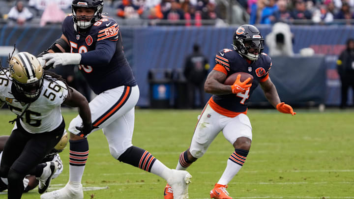 D'Andre Swift cuts behind a block by Darnell Wright in Sunday's Bears win.