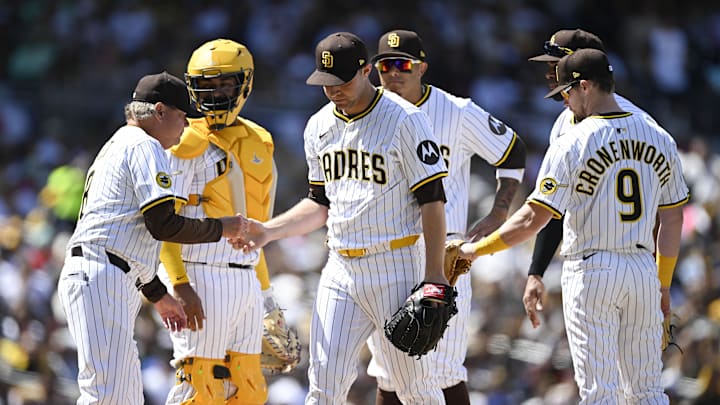 Mar 27, 2025; San Diego, California, USA; San Diego Padres starting pitcher Michael King (34), center, leaves the game during the third inning of a baseball game against the Atlanta Braves at Petco Park. Mandatory Credit: Denis Poroy-Imagn Images Mar 27, 2025; San Diego, California, USA; San Diego Padres starting pitcher Michael King (34), center, leaves the game during the third inning of a baseball game against the Atlanta Braves at Petco Park. Mandatory Credit: Denis Poroy-Imagn Images