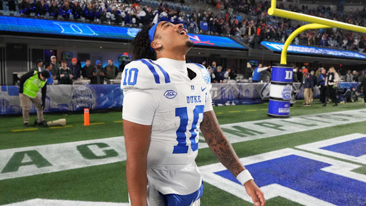 Dec 6, 2025; Charlotte, NC, USA; Duke Blue Devils quarterback Darian Mensah (10) reacts after winning the  ACC Championship game at Bank of America Stadium. Mandatory Credit: Bob Donnan-Imagn Images