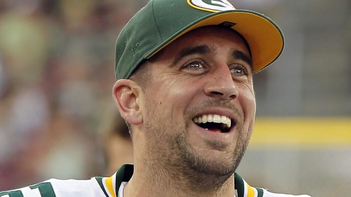 Dec. 21, 2014; Tampa, FL, USA; Green Bay Packers quarterback Aaron Rodgers (12) smiles on the sidelines against the Tampa Bay Buccaneers during the second half at Raymond James Stadium. Green Bay Packers defeated the Tampa Bay Buccaneers 20-3.