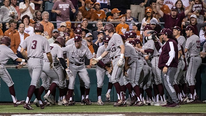 Texas A&M cheers after a grand slam during the game at Disch-Falk Field on Tuesday, March 29,