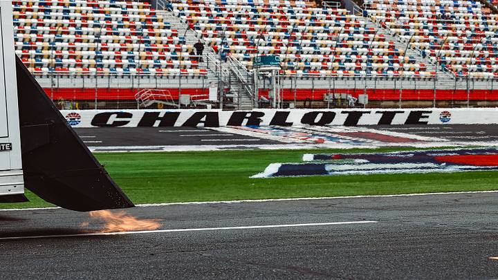 A jet-dryer truck attempts to dry the Charlotte Motor Speedway pit road during a weather delay on Saturday, May 23. A jet-dryer truck attempts to dry the Charlotte Motor Speedway pit road during a weather delay on Saturday, May 23.