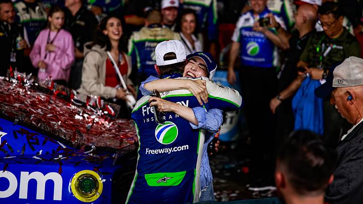 Daniel Suarez and his wife, Julia, share a warm embrace in Charlotte Motor Speedway's Victory Lane after a rain-shortened win in the Coca-Cola 600.