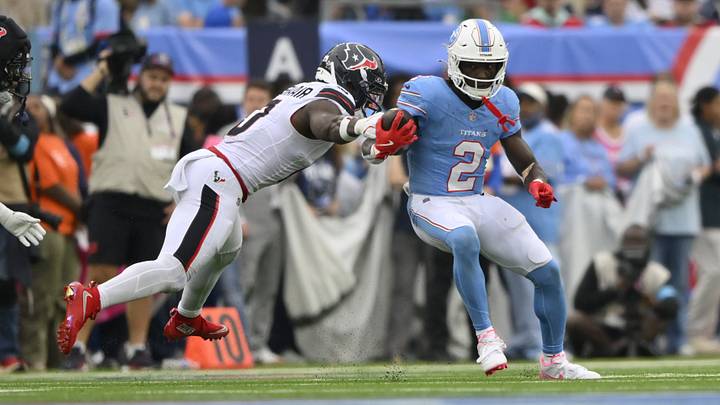 Oct 11, 2026; Nashville, Tennessee, USA; Tennessee Titans running back Tyjae Spears (2) runs after a made catch against Houston Texans linebacker Azeez Al-Shaair (0) at Nissan Stadium. Mandatory Credit: Steve Roberts-Imagn Images Oct 11, 2026; Nashville, Tennessee, USA; Tennessee Titans running back Tyjae Spears (2) runs after a made catch against Houston Texans linebacker Azeez Al-Shaair (0) at Nissan Stadium. Mandatory Credit: Steve Roberts-Imagn Images
