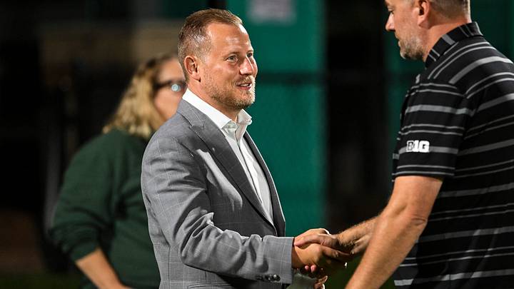 Michigan State Athletic Director Dan Bartholomae, left, shakes hands with women’s soccer head coach Jeff Hosler after the Spartans 1-0 victory over Loyola on Wednesday, Aug. 19, 2026, at DeMartin Stadium in East Lansing. Michigan State Athletic Director Dan Bartholomae, left, shakes hands with women’s soccer head coach Jeff Hosler after the Spartans 1-0 victory over Loyola on Wednesday, Aug. 19, 2026, at DeMartin Stadium in East Lansing.