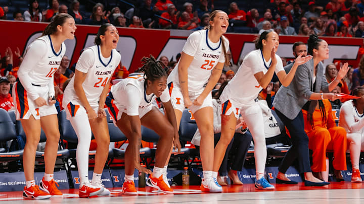 Members of the Illinois women's basketball team cheer on their teammates in the Illini's 76-65 win over Illinois State on Sunday at the State Farm Center in Champaign, Illinois.
