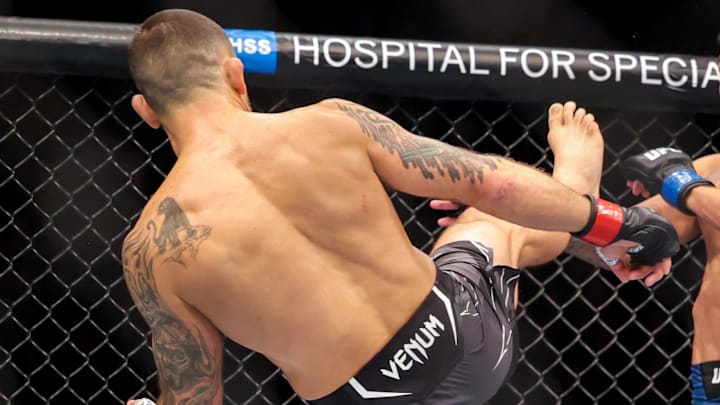 Nov 12, 2022; New York, NY, USA; Frankie Edgar (red gloves) and Chris Gutierrez (blue gloves) during UFC 281 at Madison Square Garden. Mandatory Credit: Jessica Alcheh-Imagn Images