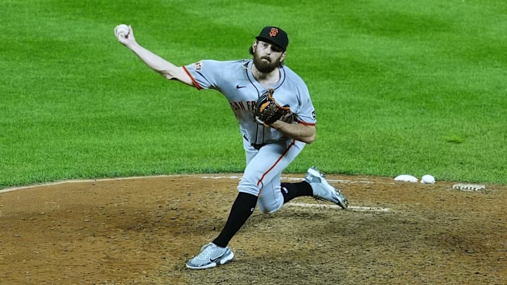 Sep 2, 2025; Denver, Colorado, USA; San Francisco Giants relief pitcher Ryan Walker (74) delivers a pitch in the ninth inning against the Colorado Rockies at Coors Field. Mandatory Credit: Ron Chenoy-Imagn Images
