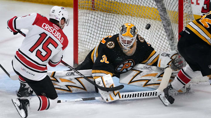 Providence Bruins goalie Michael DiPietro deflects a shot from Charlotte Checkers center Kyle Criscuolo in the second period. Providence Bruins goalie Michael DiPietro deflects a shot from Charlotte Checkers center Kyle Criscuolo in the second period.