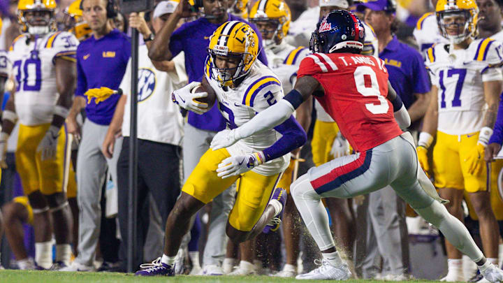 Oct 12, 2024; Baton Rouge, Louisiana, USA;  LSU Tigers wide receiver Kyren Lacy (2) catches a pass against Mississippi Rebels cornerback Trey Amos (9) during the first half at Tiger Stadium.