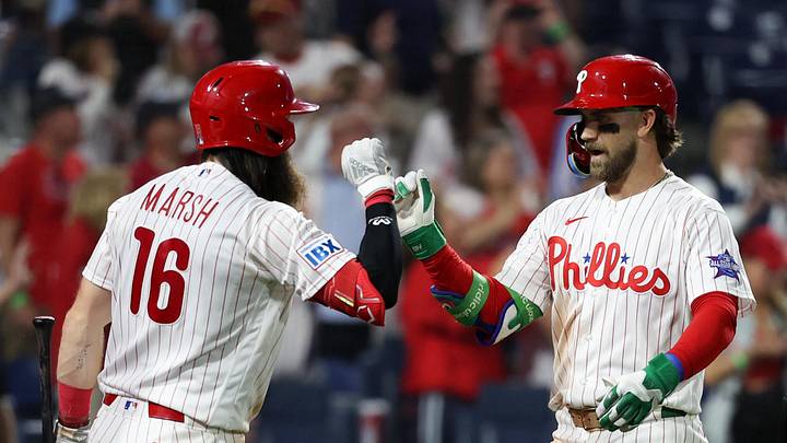 May 5, 2026; Philadelphia, Pennsylvania, USA; Philadelphia Phillies first baseman Bryce Harper (3) high fives left fielder Brandon Marsh (16) after hitting a two RBI home run during the eighth inning against the Athletics at Citizens Bank Park.