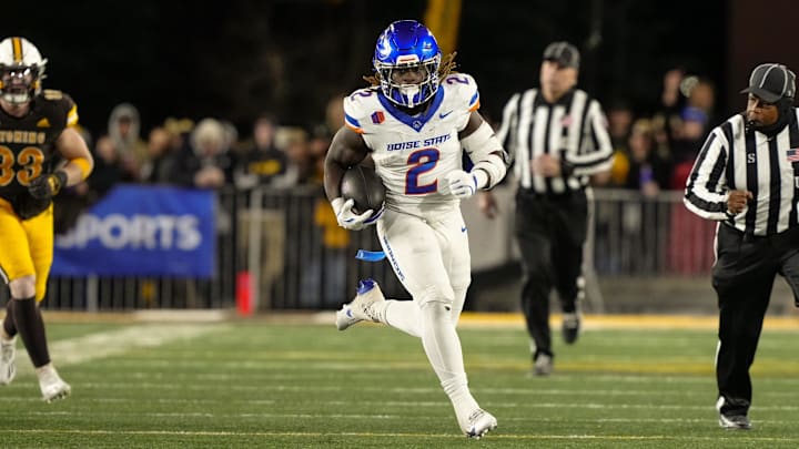 Boise State Broncos running back and Heisman Trophy candidate Ashton Jeanty runs for a touchdown against the Wyoming Cowboys.