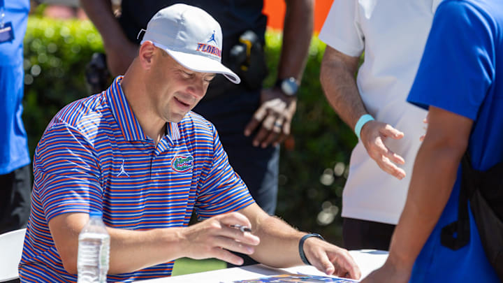 Florida head coach Jon Sumrall autographs items during the second half of the Orange and Blue game at Steve Spurrier Field at Ben Hill Griffin Stadium in Gainesville, FL on Saturday, April 11, 2026. [Alan Youngblood/Gainesville Sun]