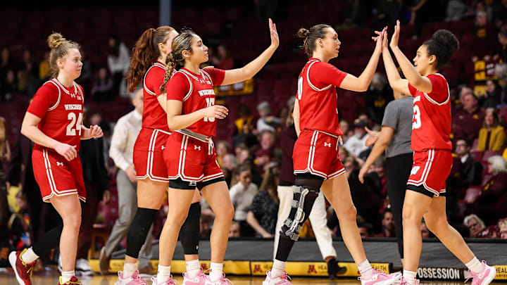 Feb 20, 2024; Minneapolis, Minnesota, USA; Wisconsin Badgers players celebrate the win against the Minnesota Golden Gophers during the second half at Williams Arena. Feb 20, 2024; Minneapolis, Minnesota, USA; Wisconsin Badgers players celebrate the win against the Minnesota Golden Gophers during the second half at Williams Arena.