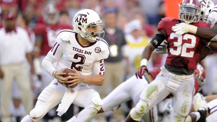 Texas A&M Aggies quarterback Johnny Manziel (2) under pressure from the Alabama Crimson Tide defense during second quarter of their football game at Bryant Denny Stadium. Texas A&M Aggies quarterback Johnny Manziel (2) under pressure from the Alabama Crimson Tide defense during second quarter of their football game at Bryant Denny Stadium.