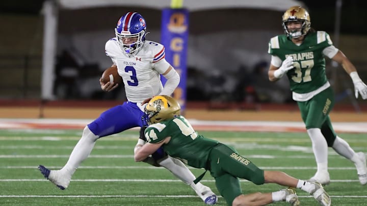 St. Bonaventure's Dylan Dunst tackles Folsom quarterback Ryder Lyons during the fourth quarter of the CIF-State Division 1-A state championship bowl at Saddleback College in Mission Viejo on Saturday, Dec. 9, 2023. St. Bonaventure lost 20-14.