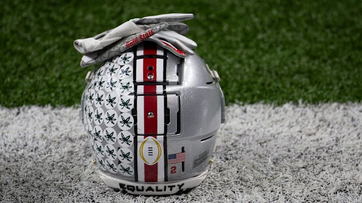 An Ohio State Buckeyes helmet sits on the sideline during warm-ups prior to the College Football Playoff semifinal against the Clemson Tigers at the Allstate Sugar Bowl in the Mercedes-Benz Superdome in New Orleans on Friday, Jan. 1, 2021. An Ohio State Buckeyes helmet sits on the sideline during warm-ups prior to the College Football Playoff semifinal against the Clemson Tigers at the Allstate Sugar Bowl in the Mercedes-Benz Superdome in New Orleans on Friday, Jan. 1, 2021.