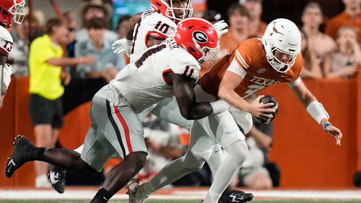 Oct 19, 2024; Austin, Texas, USA; Georgia Bulldogs linebacker Jalon Walker sacks Texas Longhorns quarterback Quinn Ewers in the second quarter at Darrell K. Royal Texas Memorial Stadium. Mandatory Credit: Jay Janner/USA TODAY Network via Imagn Images Oct 19, 2024; Austin, Texas, USA; Georgia Bulldogs linebacker Jalon Walker sacks Texas Longhorns quarterback Quinn Ewers in the second quarter at Darrell K. Royal Texas Memorial Stadium. Mandatory Credit: Jay Janner/USA TODAY Network via Imagn Images